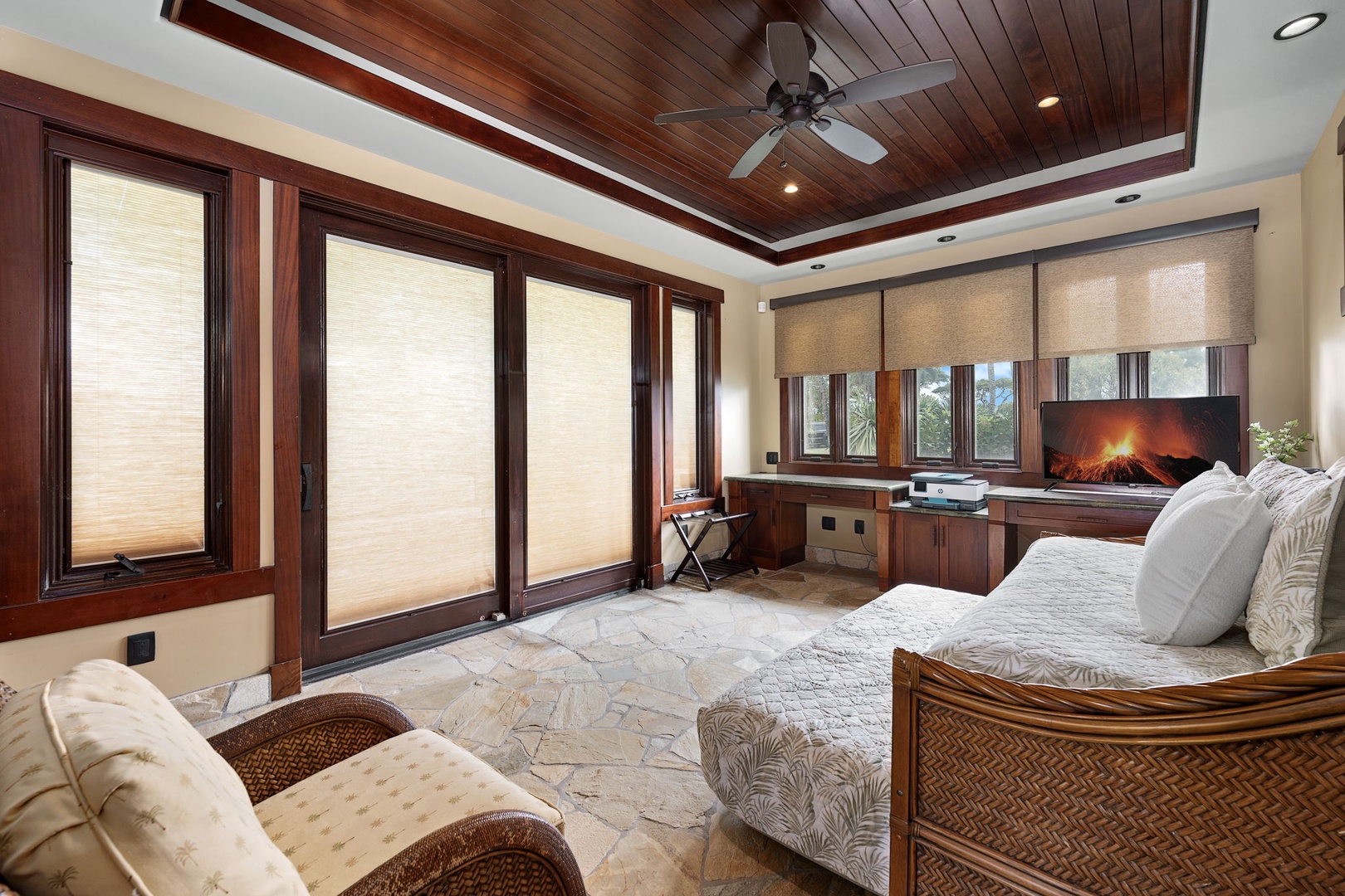 Kamuela Vacation Rentals, Hale Konane - Spacious bedroom or home office with custom seating, floor-to-ceiling windows, and serene garden views.