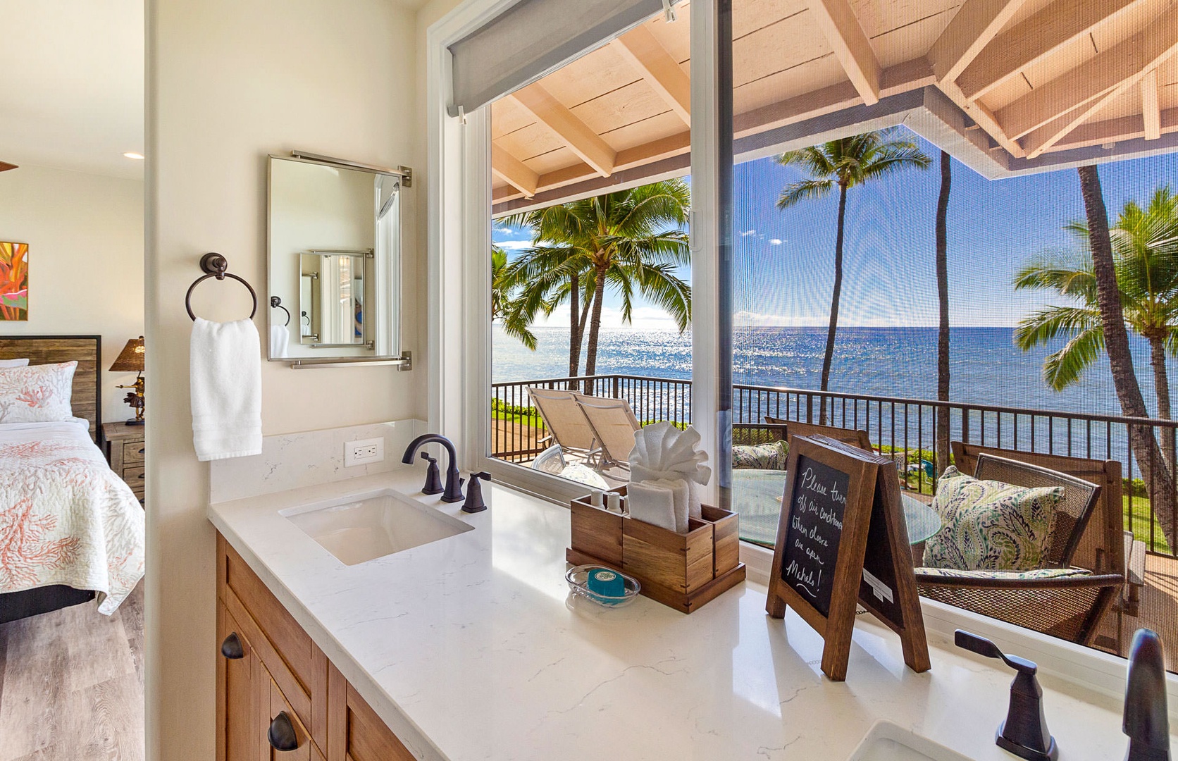 Lahaina Vacation Rentals, Puamana 240-3 - Refresh in a stylish Primary Ensuite with a scenic tropical backdrop.