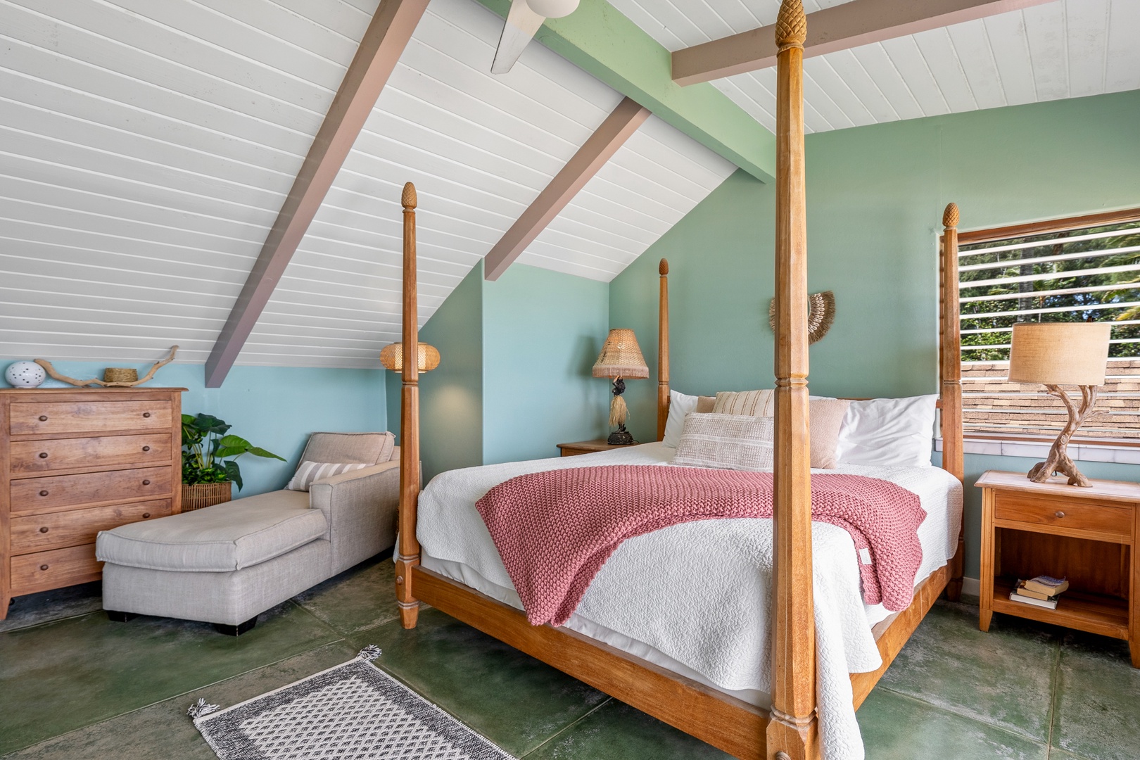 Hanalei Vacation Rentals, Hale Kepuhi - Relax in your tropical four-poster bedroom with vaulted ceilings, warm wood furnishings, and calming seafoam walls that create a serene island retreat.