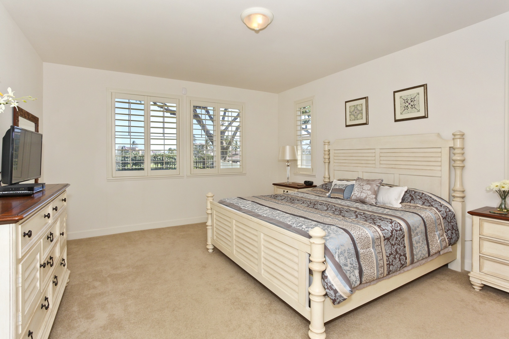 Kapolei Vacation Rentals, Ko Olina Kai Estate #20 - The spacious primary guest bedroom with coastal furnishings.