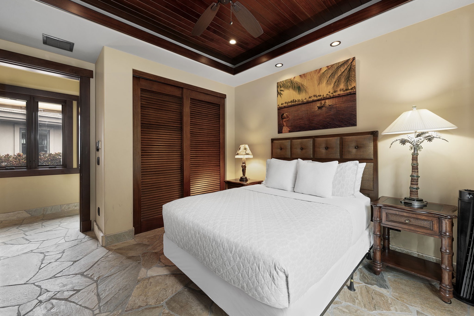 Kamuela Vacation Rentals, Hale Konane - Relax in a plush queen bed, surrounded by warm tones and tropical décor for a peaceful retreat.