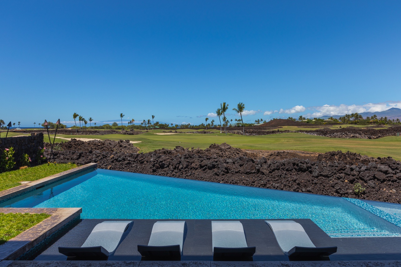 Waimea Vacation Rentals, 5BD Mauna Lani Lux Golf Estate (4) at One Ocean - Enjoy a refreshing dip in the pool with a serene golf course view, perfect for a sunny afternoon.