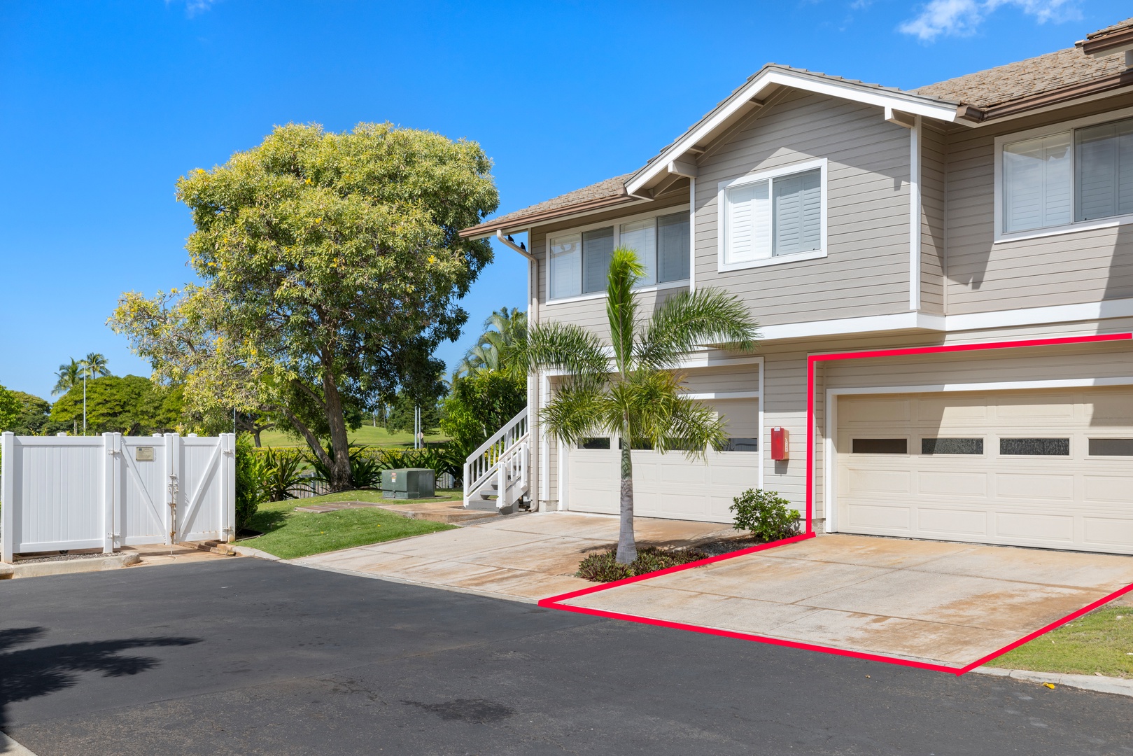 Kapolei Vacation Rentals, Fairways at Ko Olina 24H - The home features a spacious two-car garage and a beautifully maintained exterior.