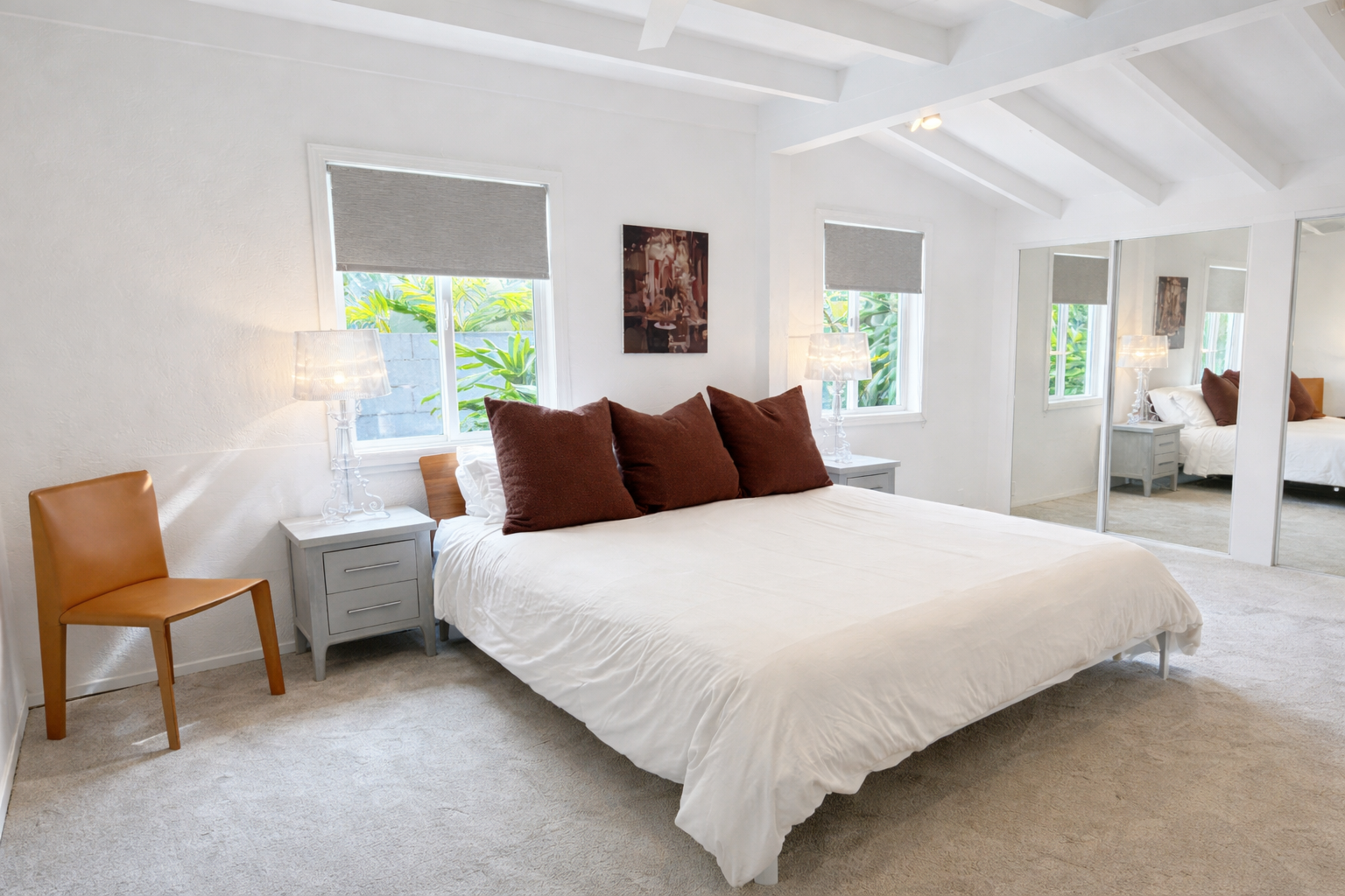 Honolulu Vacation Rentals, Ho'okipa Villa - Unwind in your master suite with a bright, airy bedroom with vaulted ceilings and garden views through multiple windows.