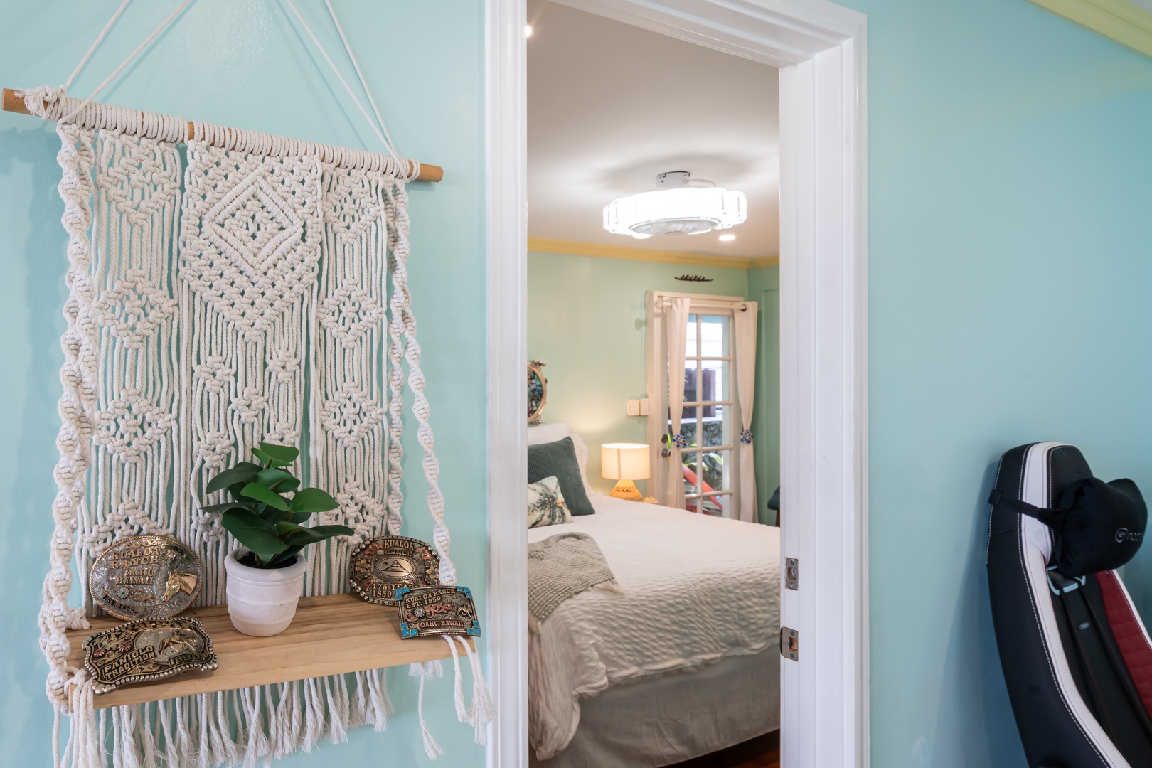 Hauula Vacation Rentals, Private Beach Paradise - Handwoven macrame and soft light set the tone on the way to the bedroom.