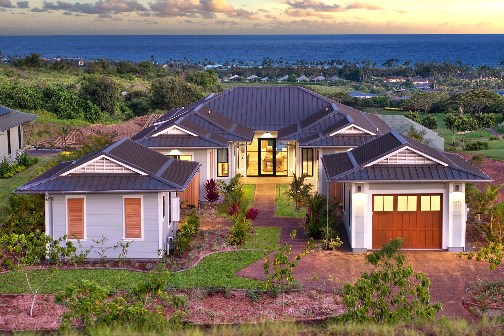 Koloa Vacation Rentals, Hali'a Mai - From above, the single-level home spreads across the hillside with the Pacific stretching out below.