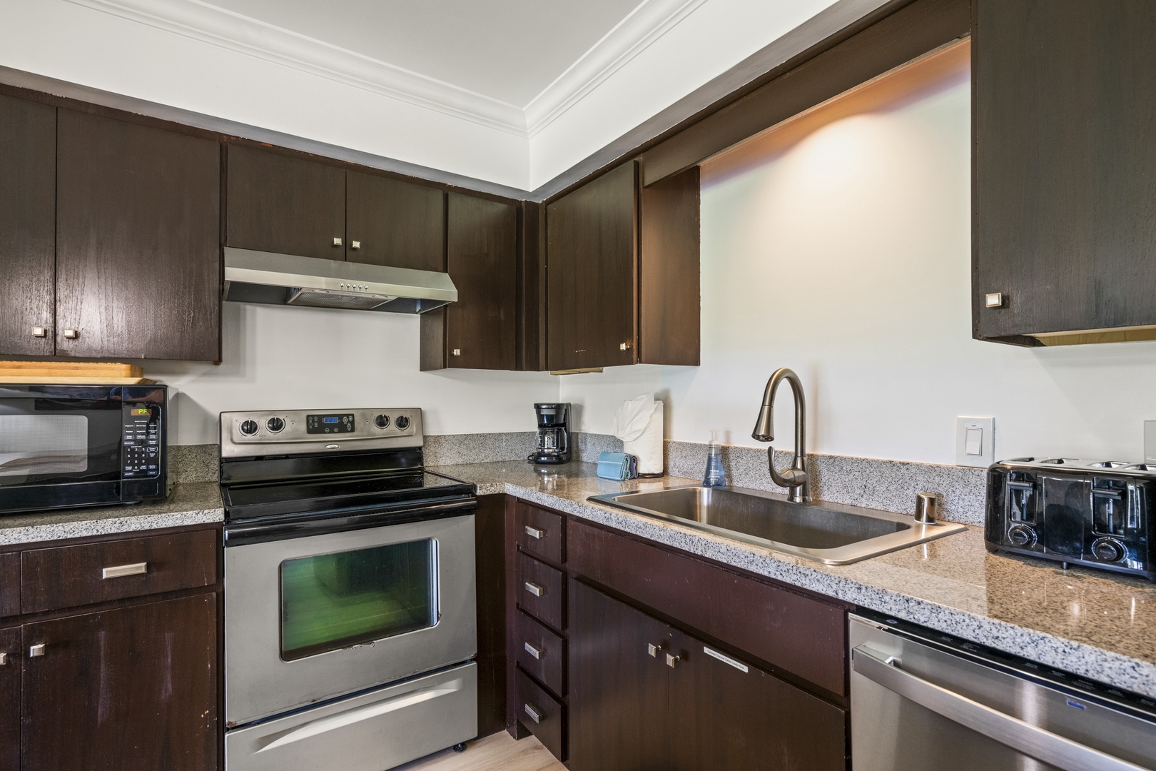 Kihei Vacation Rentals, Koa Resort 1B - Stainless range, oven, and dishwasher mean a real meal comes together easily with kitchen tools right at hand and modern appliances.