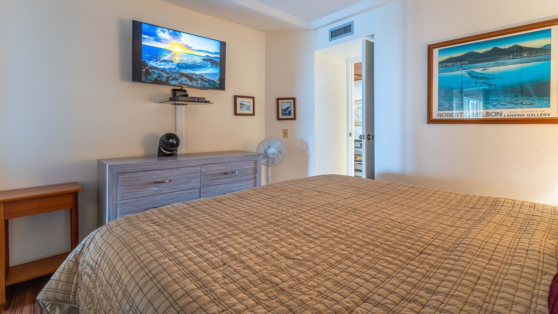 Waianae Vacation Rentals, Makaha - Hawaiian Princess - 305 - The guest bedroom with a dresser and TV.
