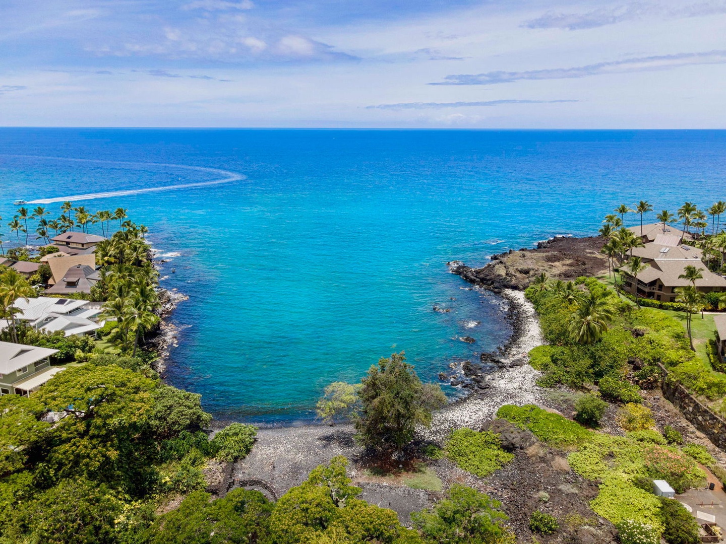 Kailua Kona Vacation Rentals, Manukai Hale - The lava-rock shoreline meets clear blue water near Heeia Bay.
