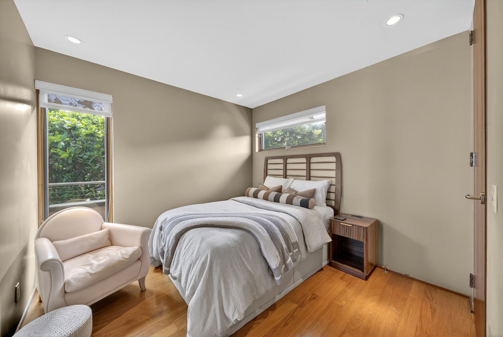 Haleiwa Vacation Rentals, HaleGator - Retreat to the peaceful bedroom featuring warm hardwood floor and serene views.