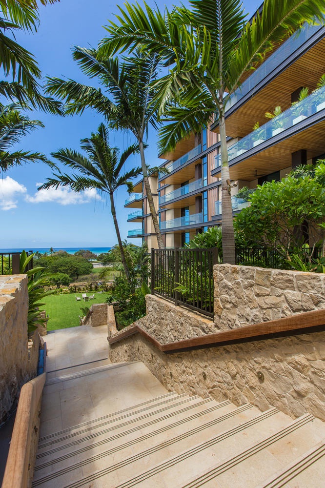 Honolulu Vacation Rentals, Park Lane Sunset Resort - Modern oceanfront property with palm trees and landscaped grounds, featuring contemporary architecture and tropical surroundings.