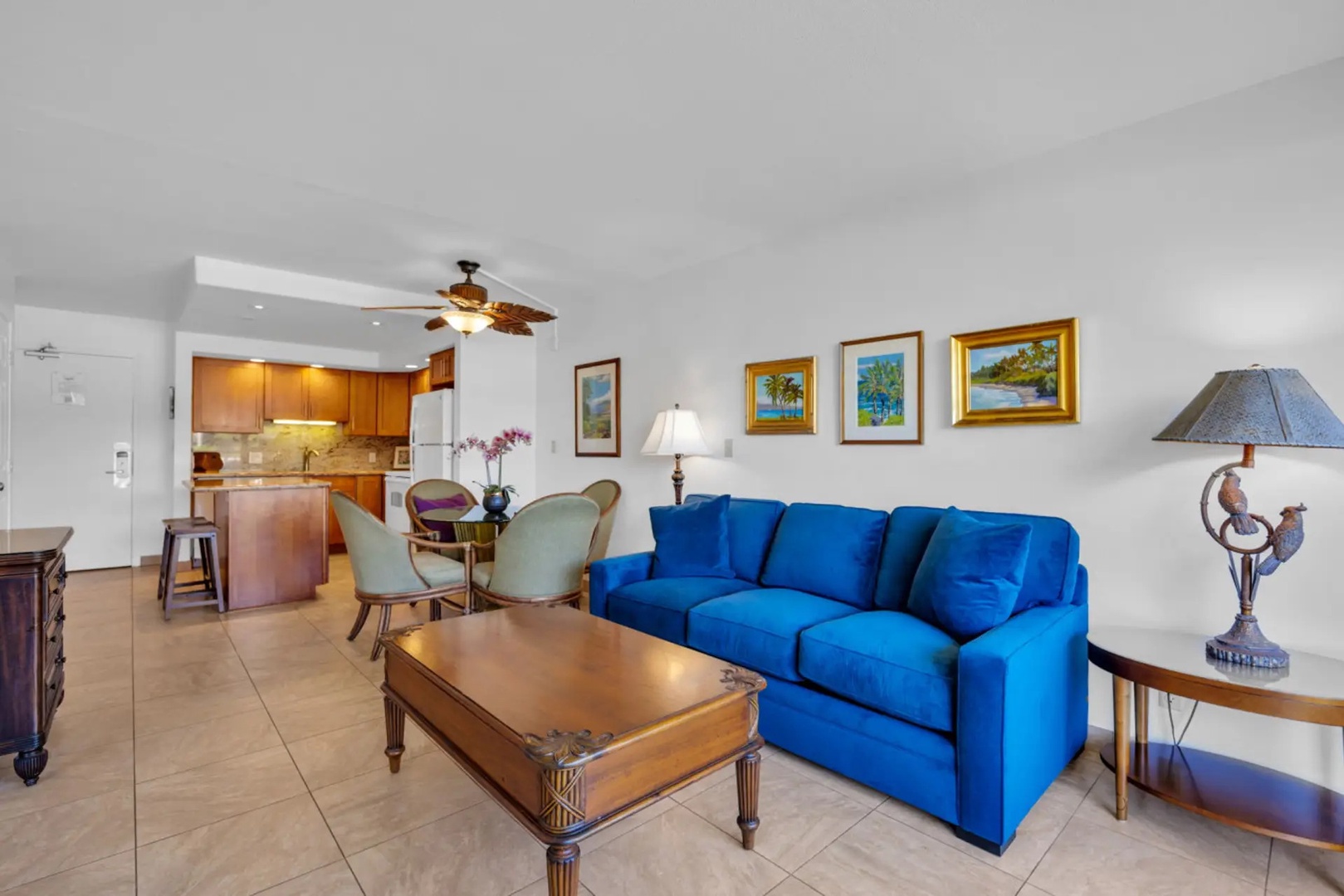 Kihei Vacation Rentals, Maui Banyan H306 - Local island paintings line the wall above a sofa built for the afternoon nobody plans.