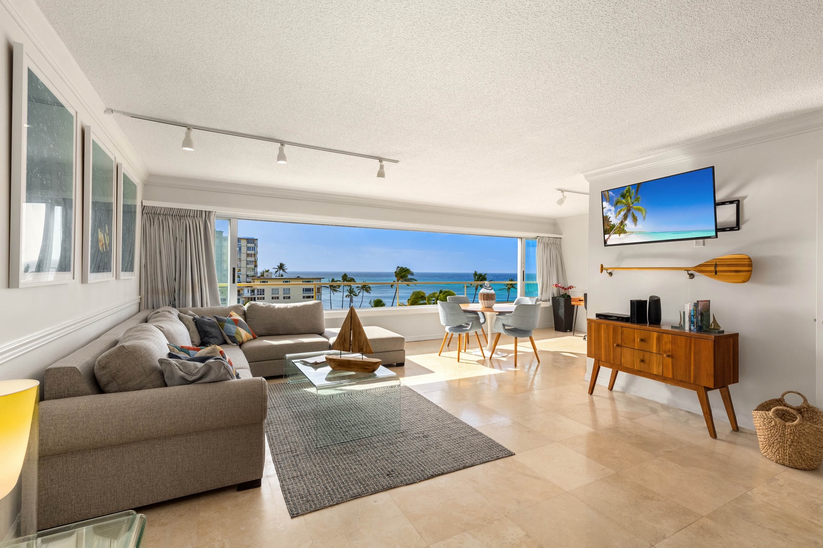 Honolulu Vacation Rentals, Colony Surf Getaway - Welcome to our bright and open living area with panoramic ocean views, blending comfort with a serene coastal vibe for a perfect retreat.