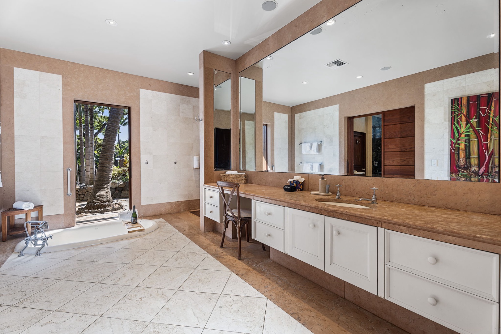 Kailua-Kona Vacation Rentals, Hahalua Bay Villa - Luxurious spa-like bathroom featuring elegant stone counters, spacious vanity, and serene garden views for your perfect morning routine.