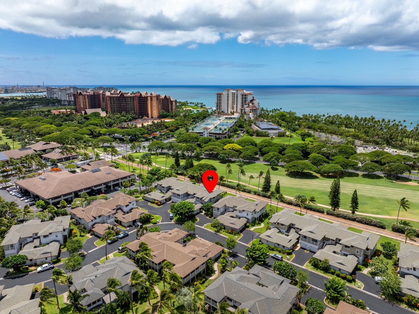 Kapolei Vacation Rentals, Coconut Plantation 1080-4 - Ocean meets the shore beyond the resort in this wide aerial.