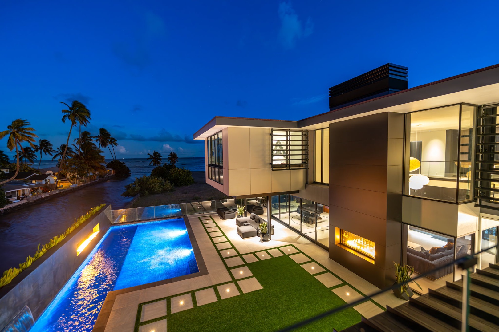 Honolulu Vacation Rentals, Ocean Villa Emilie - Twilight transforms the estate into a glowing retreat—perfect for evening swims, dinners under the stars, or entertaining with flair.