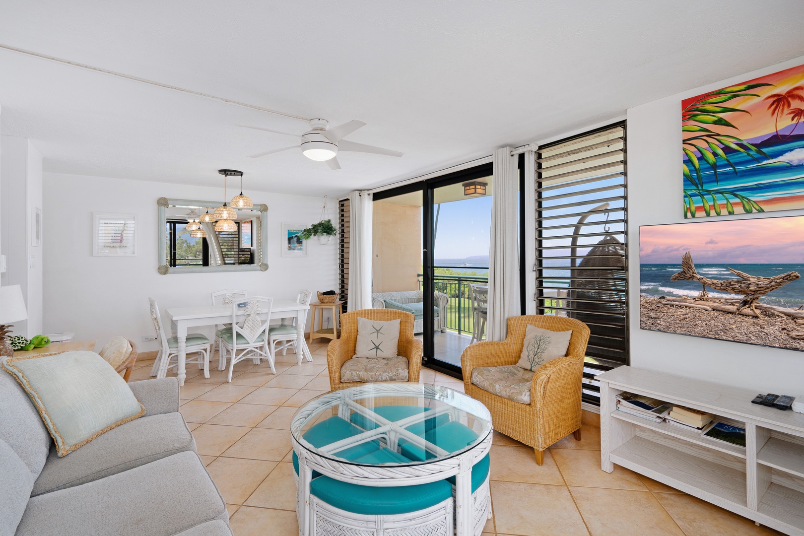 Kihei Vacation Rentals, Punahoa Beach 205 - Wicker chairs sit near the lanai doors, ocean and dining table both an easy glance away.