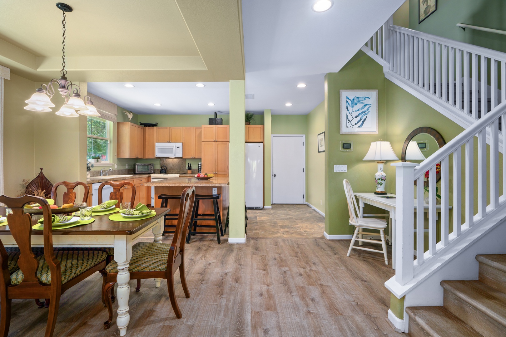 Princeville Vacation Rentals, Kaimana Villa - Gather around your spacious dining table while the chef in your group creates meals in the open kitchen nearby.