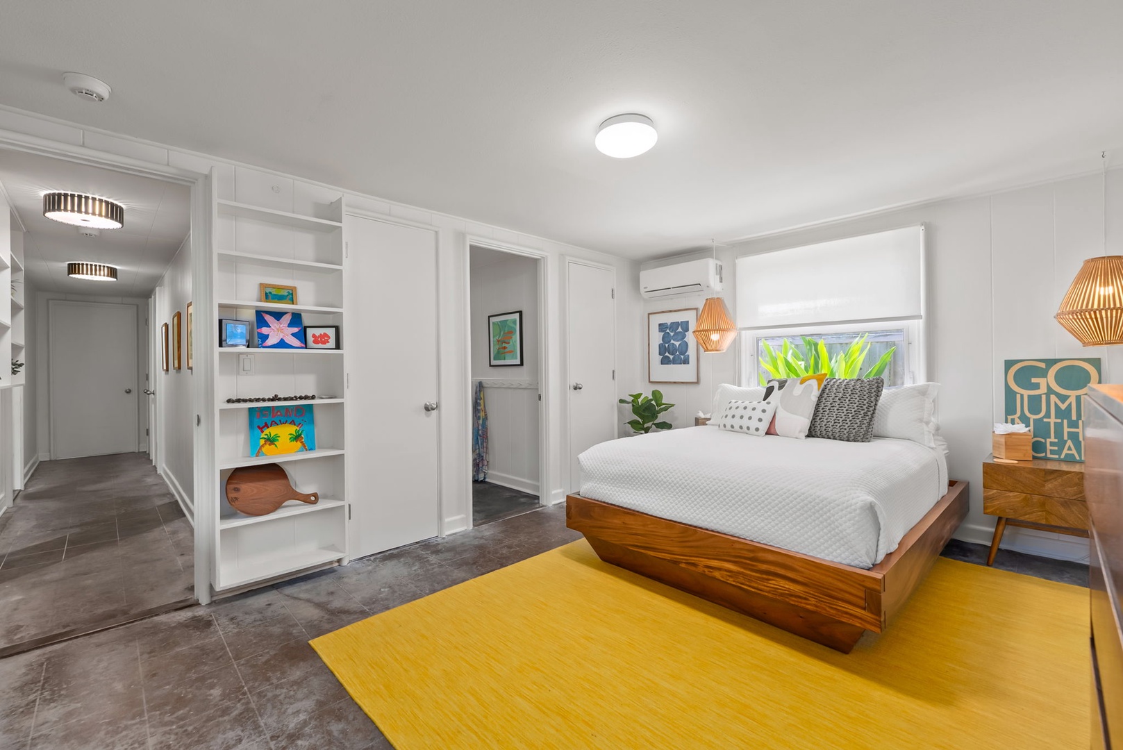 Kailua Vacation Rentals, Lanikai Oceanside 5 Bedroom - Cheerful guest bedroom with vibrant island décor and shared access to the primary bath—perfect for family or close friends.
