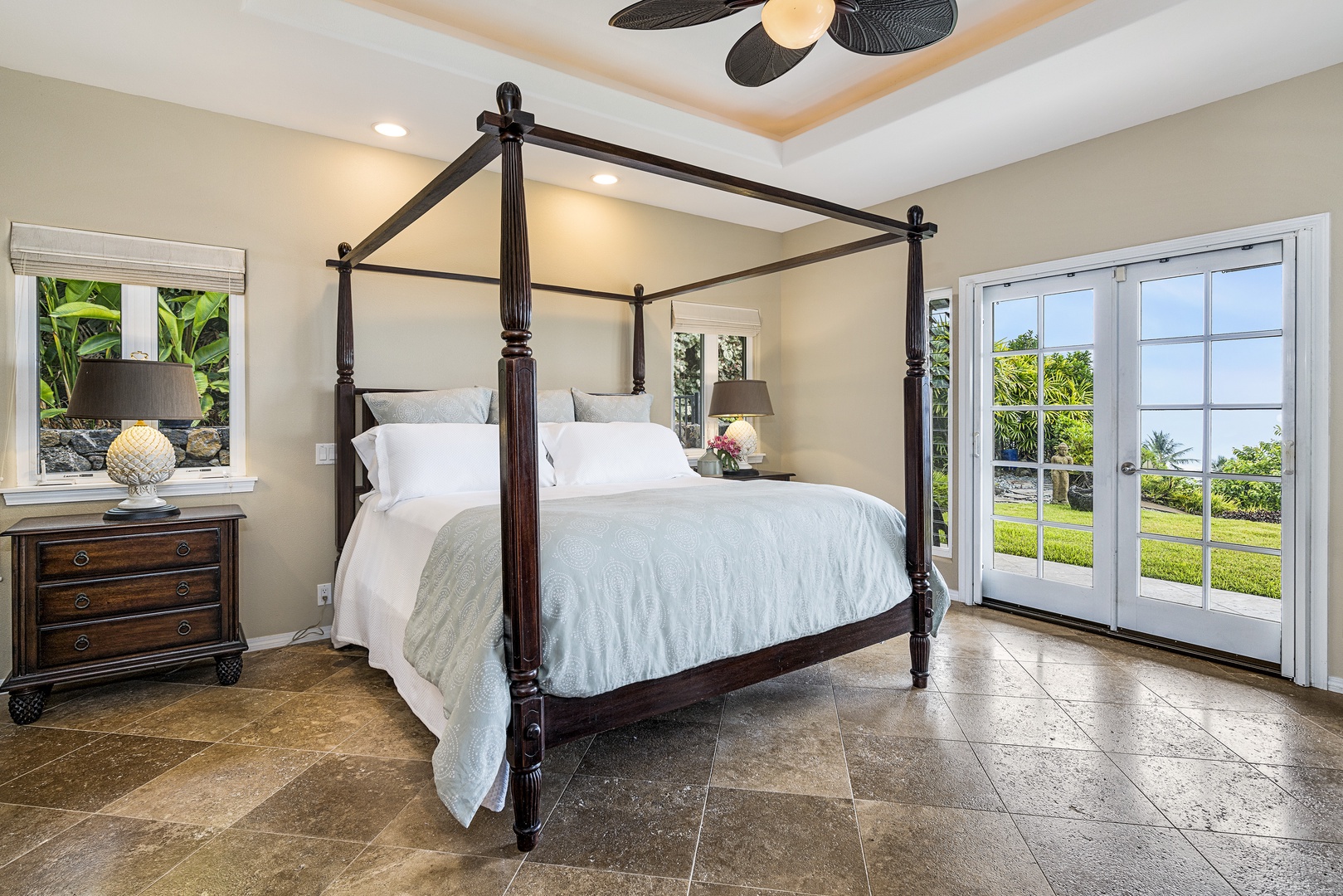 Kailua Kona Vacation Rentals, Sunset Hale - Retreat to the luxurious king suite—tray ceilings, lanai access, and serene views welcome restful nights.
