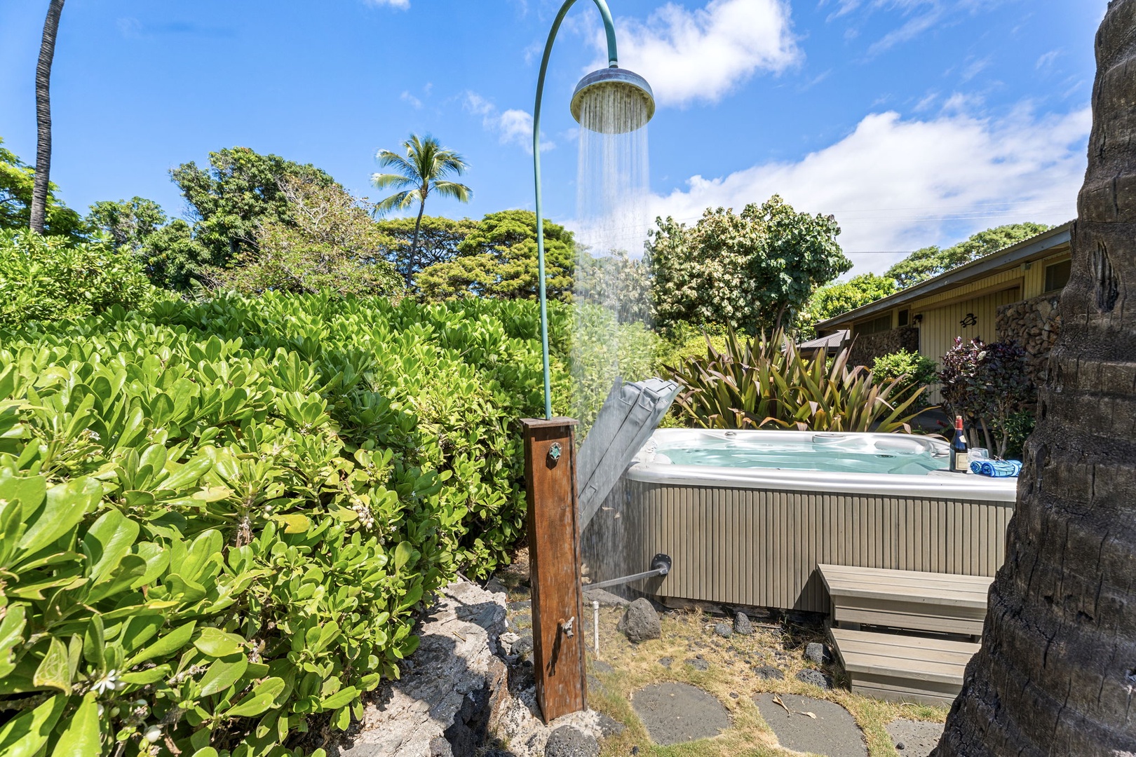 Kamuela Vacation Rentals, Island Time Retreat - An outdoor shower and a hot tub share the garden, so the salt rinses off before you climb in.