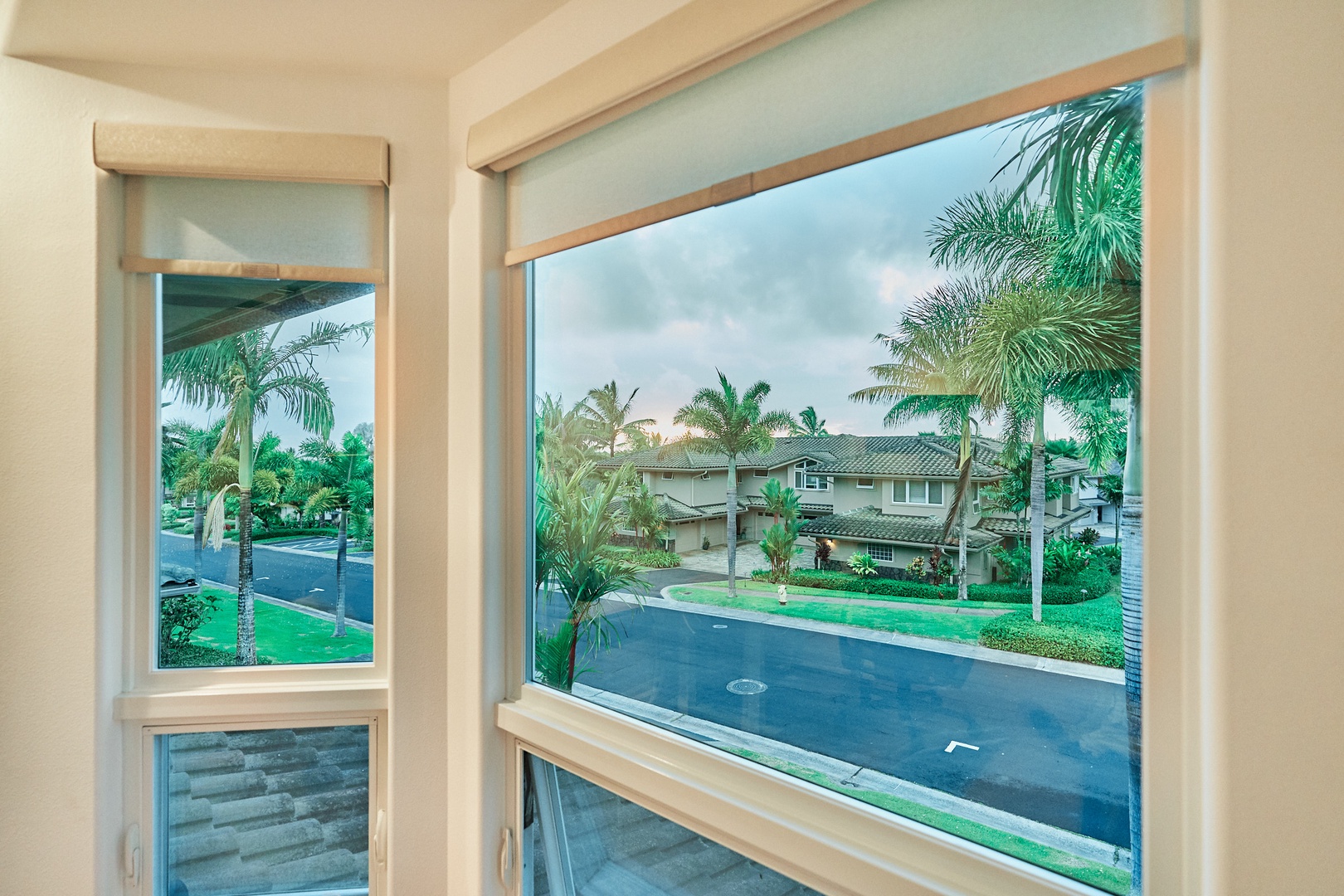 Princeville Vacation Rentals, Hale Kai - Tropical neighborhood views through your windows showcase palm-lined streets and charming homes.