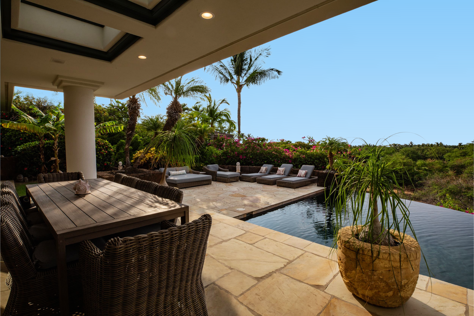 Kamuela Vacation Rentals, Canoe House at Champion Ridge - Covered outdoor seating near the pool provides the perfect shady spot to sip your morning coffee or unwind in the afternoon.