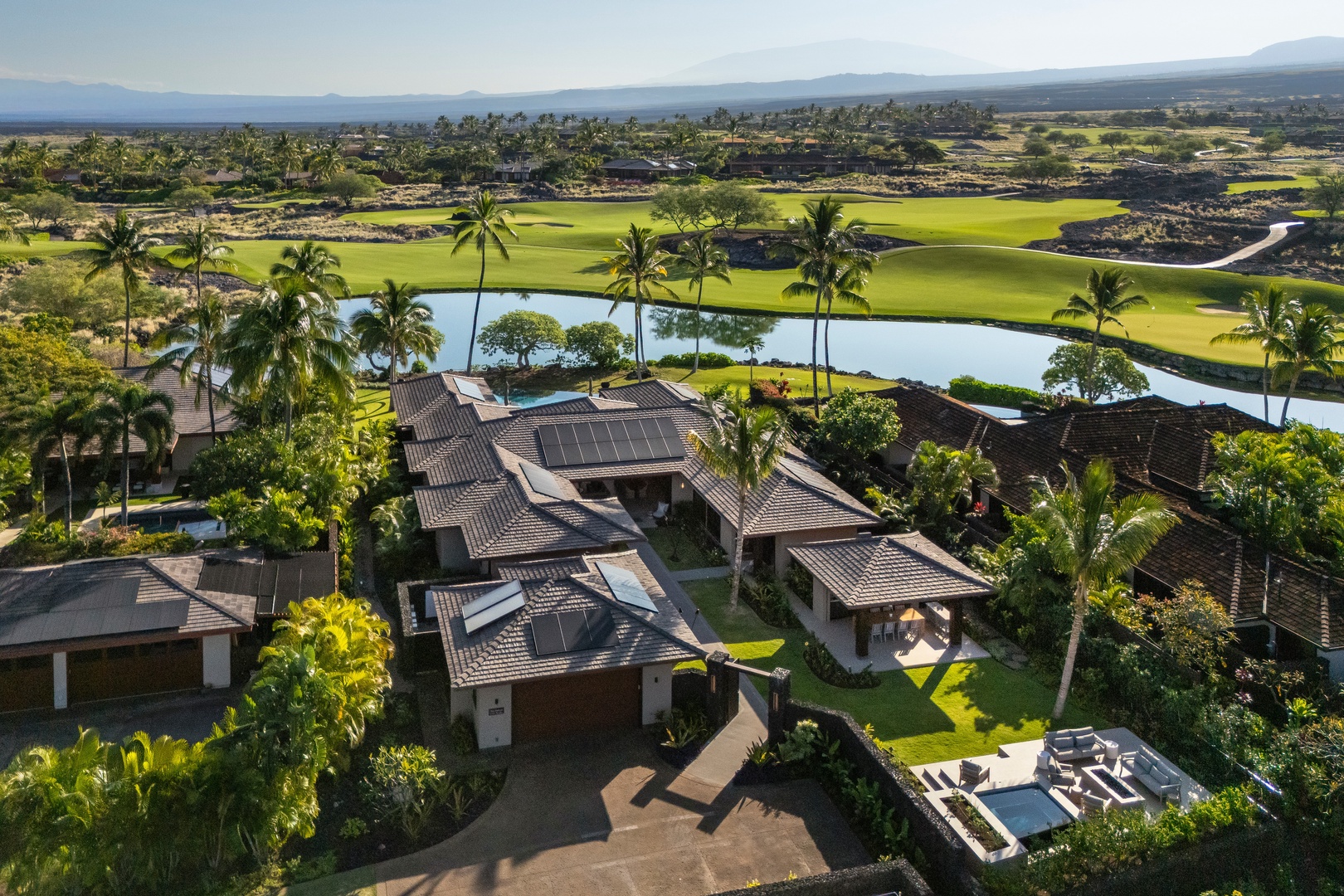 Kailua-Kona Vacation Rentals, 4BD Ka'Ulu Estate (102A) at Hualalai Resort - Stunning aerial view showcases the tropical property nestled within championship golf greens.