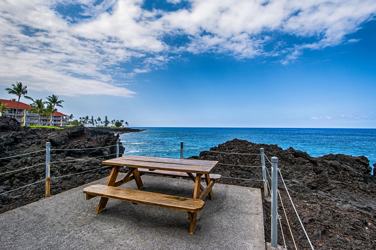 Kailua Kona Vacation Rentals, Keauhou Kona Surf & Racquet 1104 - Dine al fresco at the picnic table, set against a backdrop of breathtaking views — perfect for memorable meals under the sky.