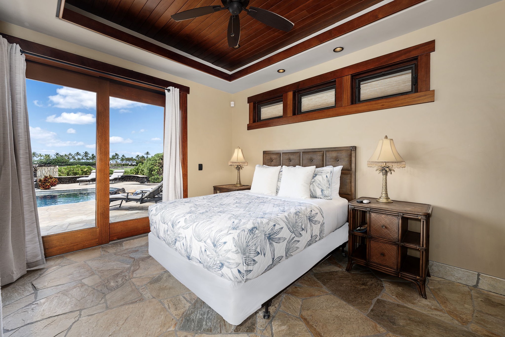 Kamuela Vacation Rentals, Hale Konane - Comfortable queen bedroom with rich wood ceilings and natural light, offering a restful retreat.