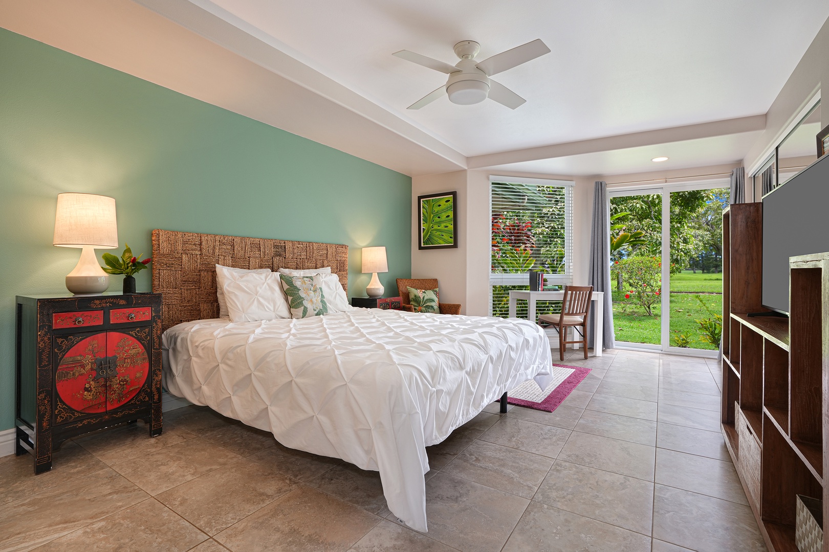 Princeville Vacation Rentals, Ku'u Lei Villa - Retreat to the spacious primary suite, featuring a king-size bed and private lanai access for morning coffee with a view.