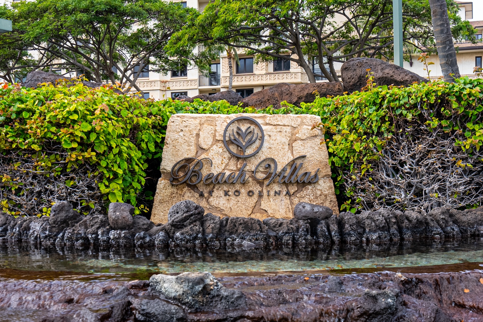The Beach Villas entry, gated and planted, the first thing you reach off the road.