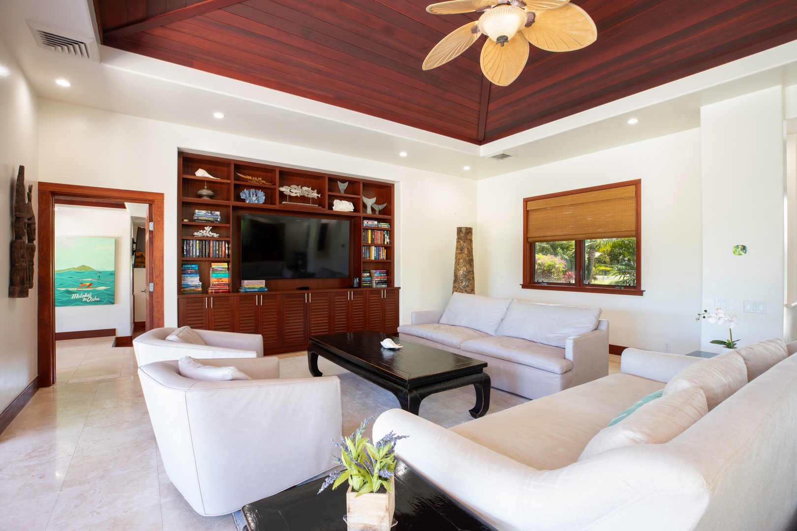 Kamuela Vacation Rentals, Canoe House & Beach Walker at Champion Ridge - Enjoy movie nights or relaxed mornings in the spacious, light-filled main living room.