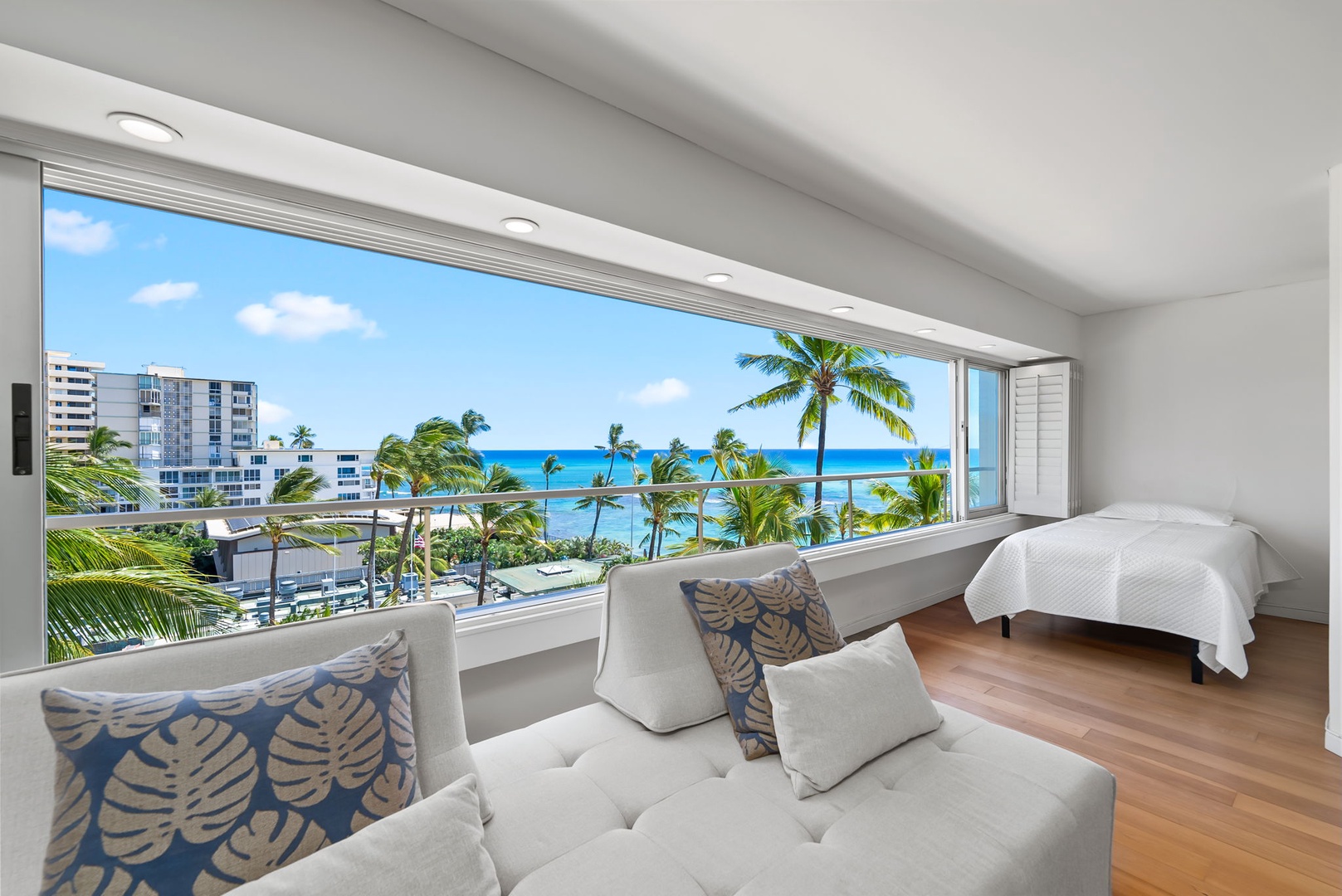 Honolulu Vacation Rentals, Colony Surf Retreat - Lounge in the stylish sitting nook with unbeatable ocean and beach views framed by oversized picture windows.