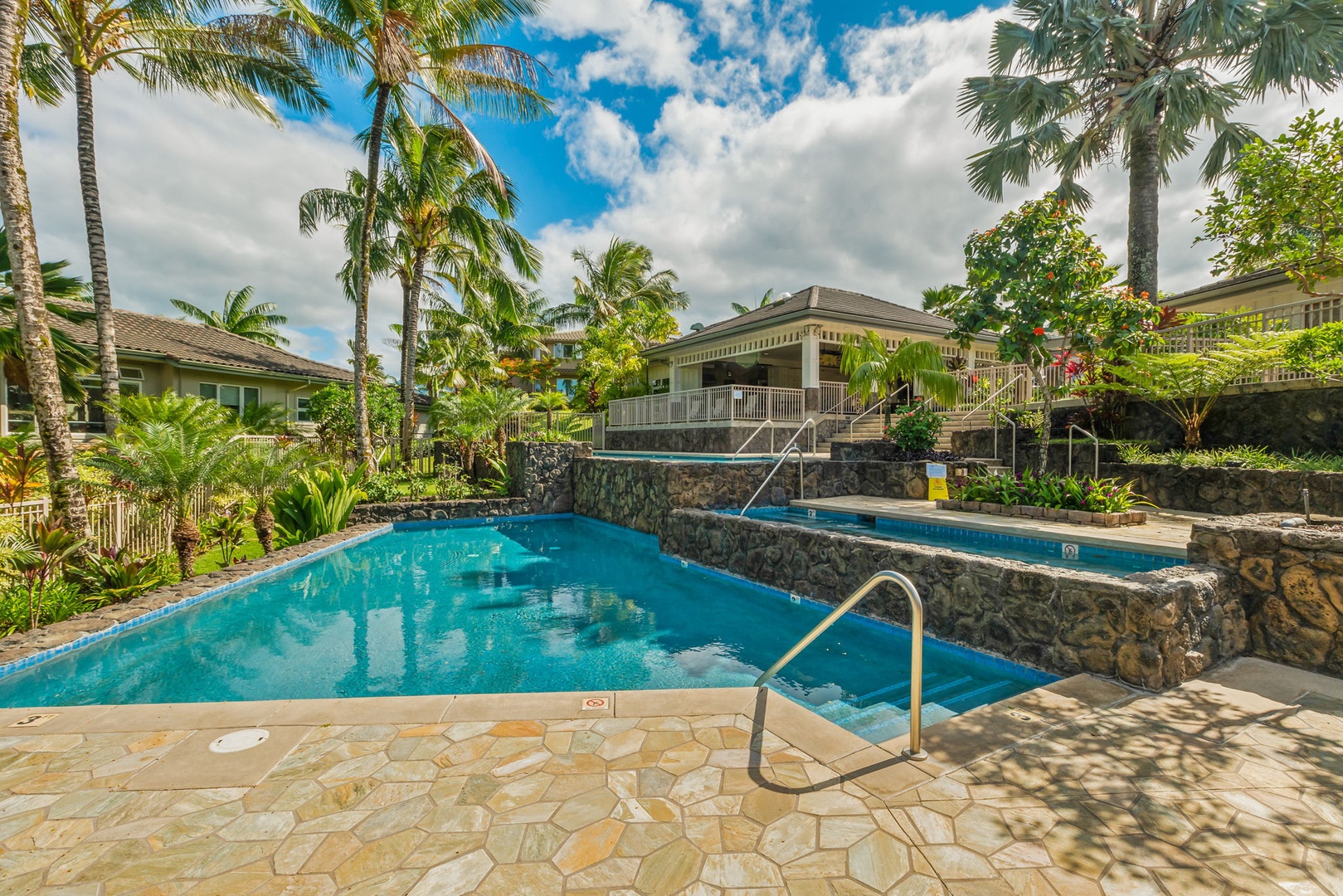 Princeville Vacation Rentals, Kaiulani #8 - Swim from one terraced pool down to the next, with stonework between the levels.