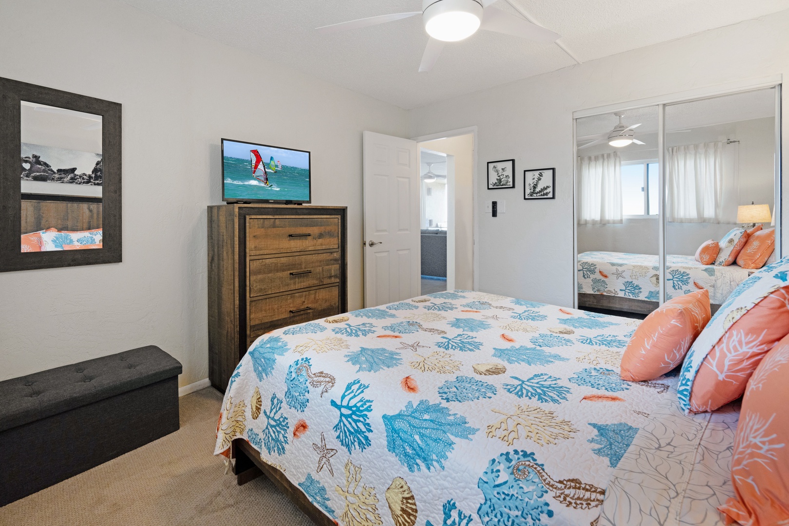 Kihei Vacation Rentals, Menehune Shores 316 - Mirrored closet doors double the light in a bedroom built around one good night's sleep.
