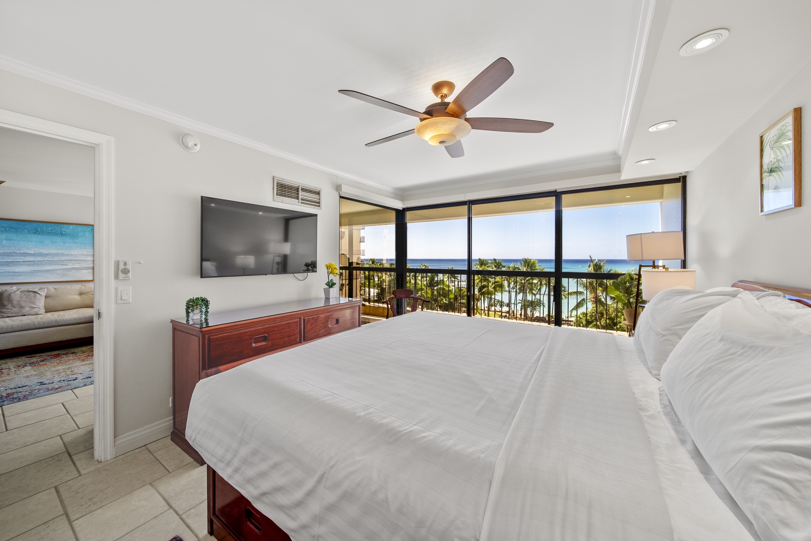 Honolulu Vacation Rentals, Aston Waikiki Beach Tower 602 - Create memorable mornings in a serene primary bedroom with ample natural light and ocean views.