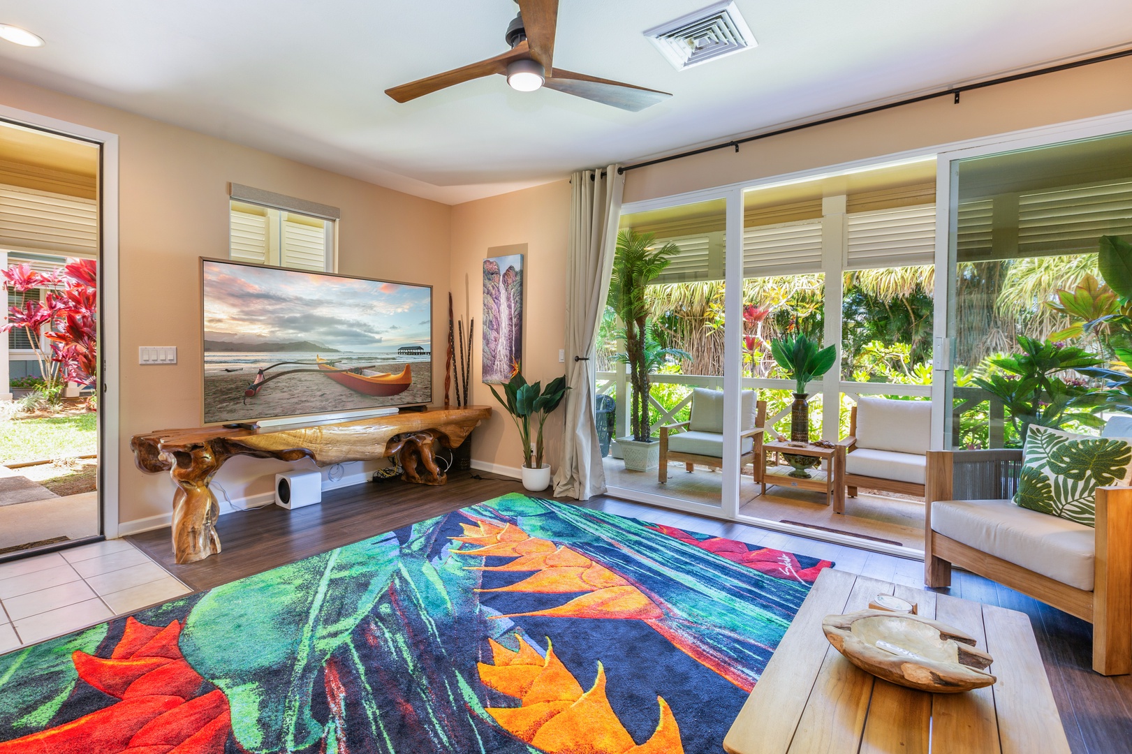 Princeville Vacation Rentals, Pualani Villa - The bright and open living room features plenty of natural light and tropical decor.