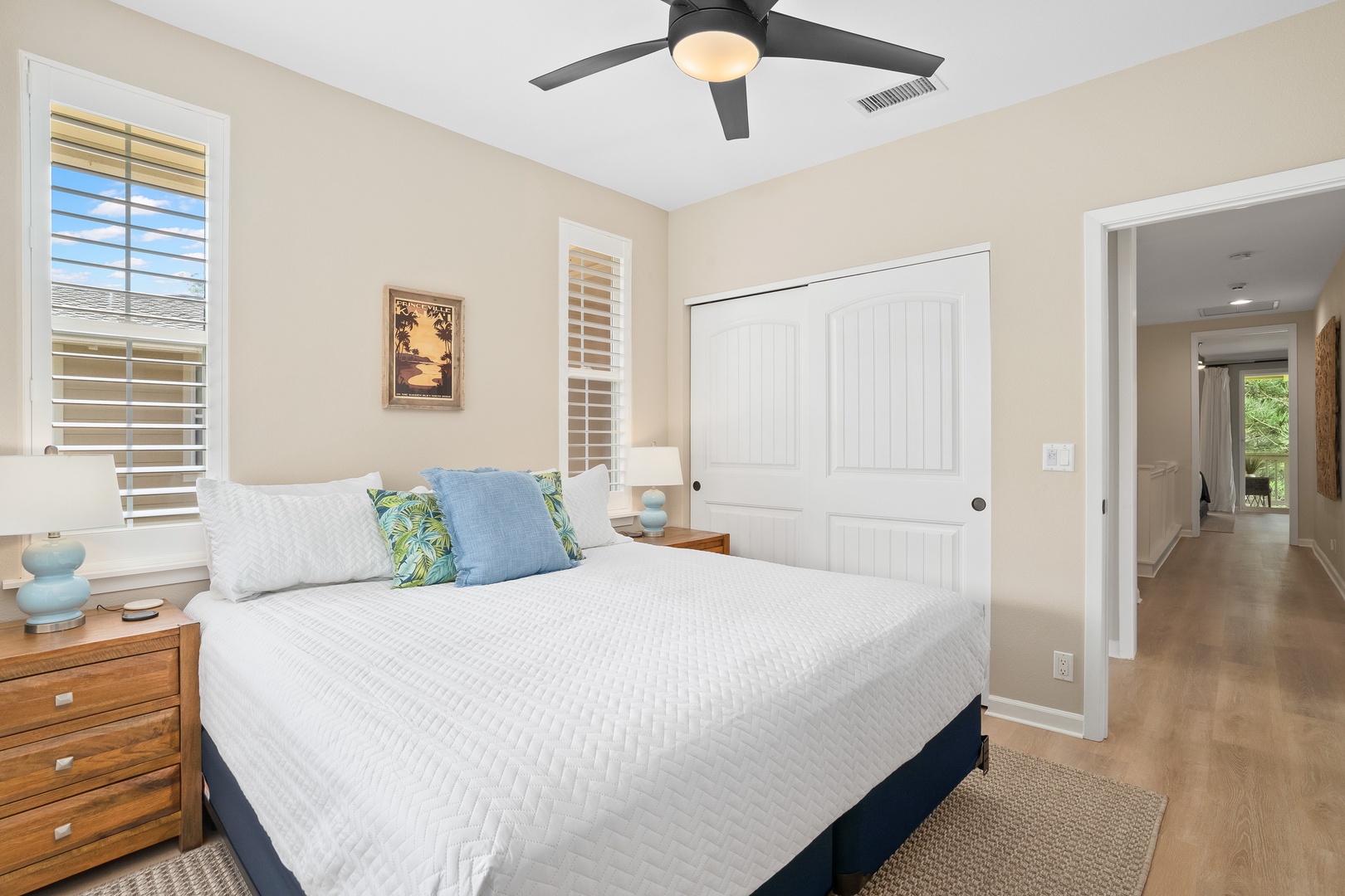 Princeville Vacation Rentals, Hale Kaua'i - Soft sunlight and crisp linens create a calm bedroom setting for restful island mornings.