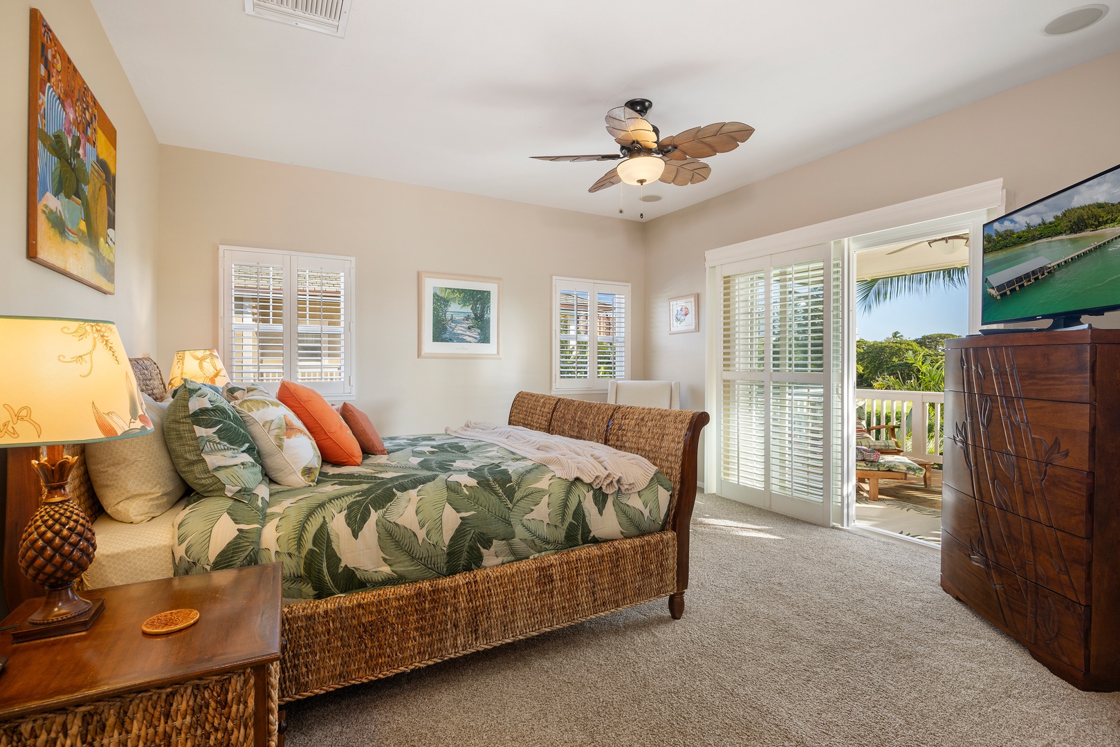 Drift off surrounded by tropical charm in your peaceful bedroom, where palm-patterned linens and warm island touches create your perfect getaway retreat.
