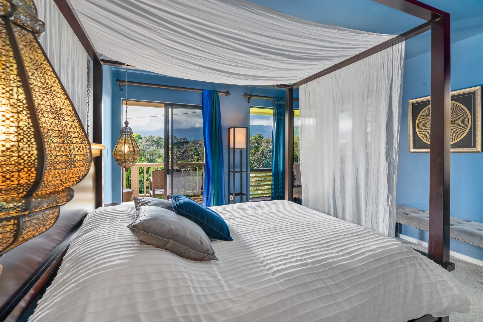 Princeville Vacation Rentals, Makanalani - Primary bedroom with a four poster bed and a private lanai access.