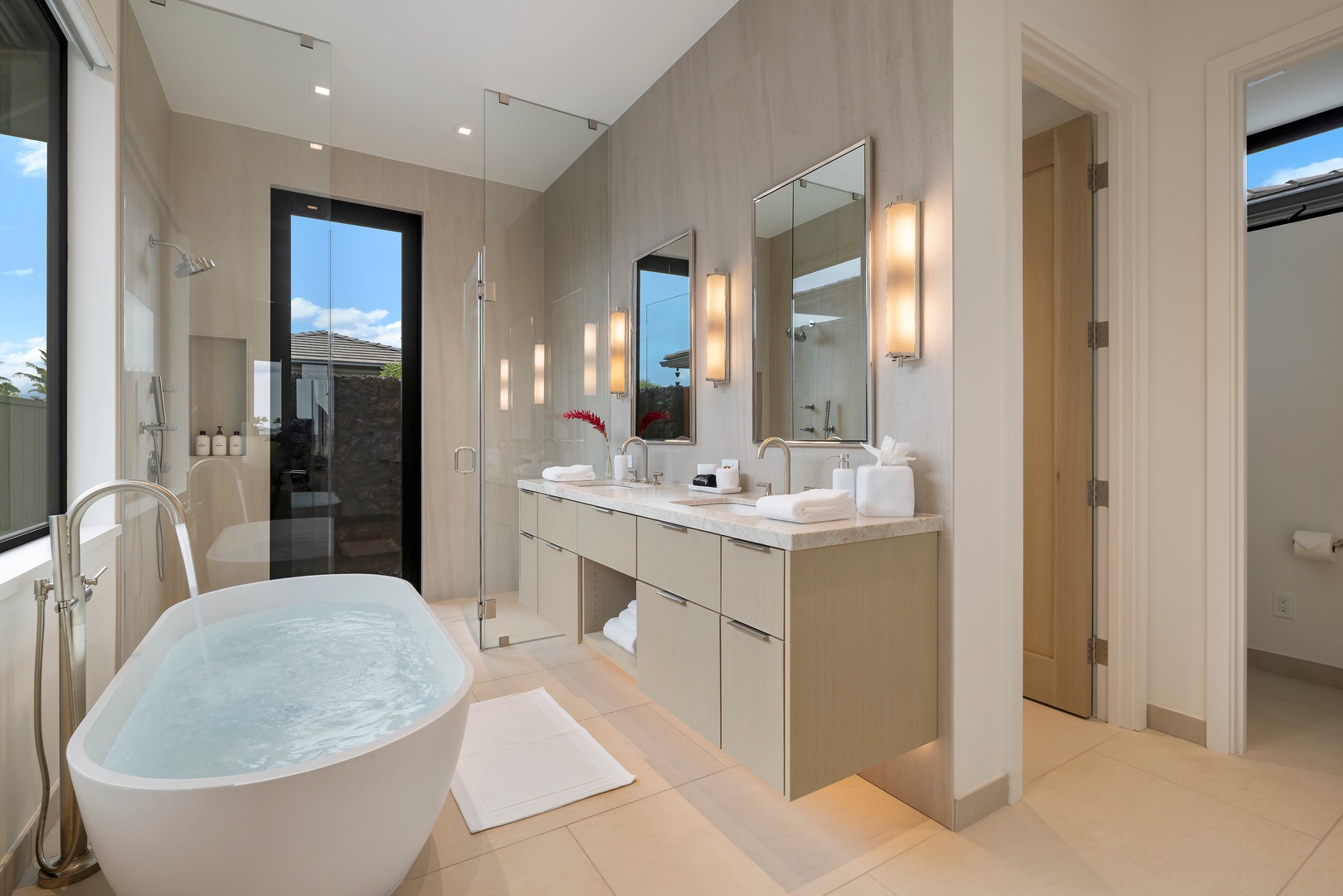 Kamuela Vacation Rentals, 6BD Mauna Lani Lux Golf Estate (6) at One Ocean - A spa-inspired Guest Suite Bath (#3) with dual vanities, a soaking tub, and space to settle into vacation mode.