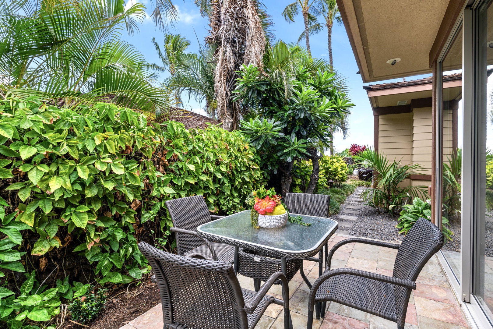 Kailua Kona Vacation Rentals, 3BD Pakui Street Estate (149) at Hualalai Resort - Find a quiet spot on the side lanai, catching the gentle trade winds before the rest of the house wakes up.