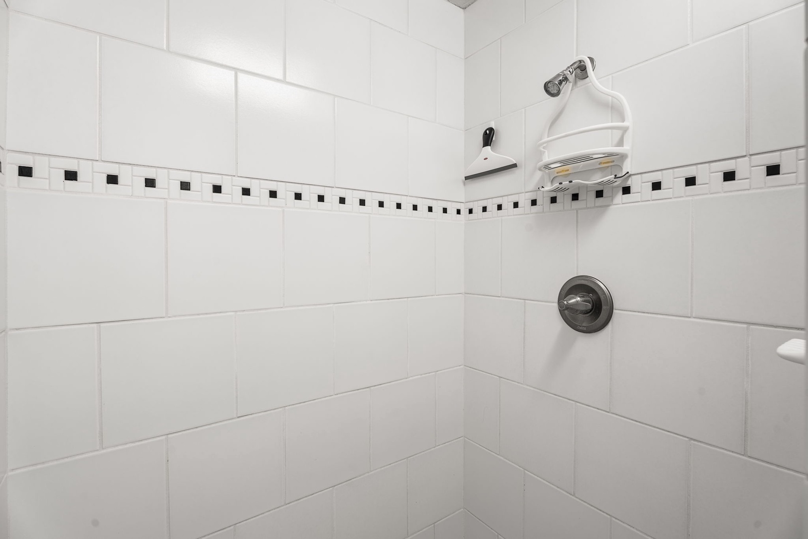Kailua Kona Vacation Rentals, Kanaloa at Kona 701 - Step into your private spa-like shower with sleek white tiles and invigorating rainfall head for the perfect start to your day.