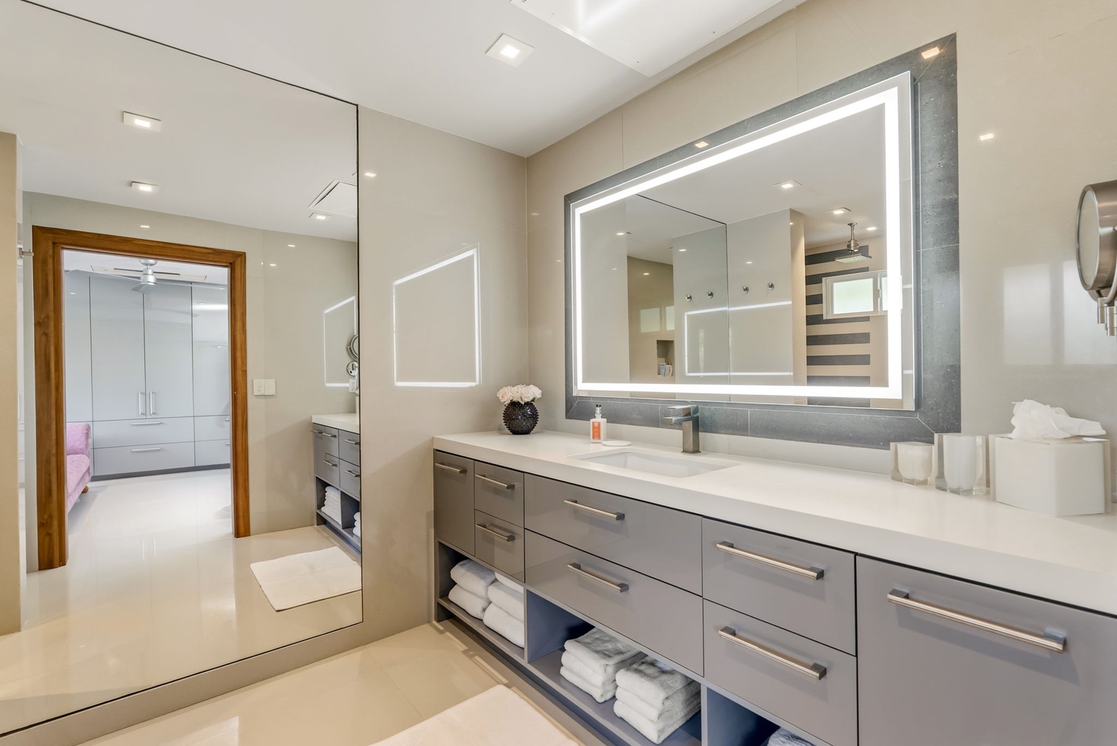 Honolulu Vacation Rentals, Diamond Head Beachfront Estate - Step into your spa-like bathroom, where sleek modern design meets everyday comfort. Ample counter space and a backlit mirror create an inviting space to start or end your day.