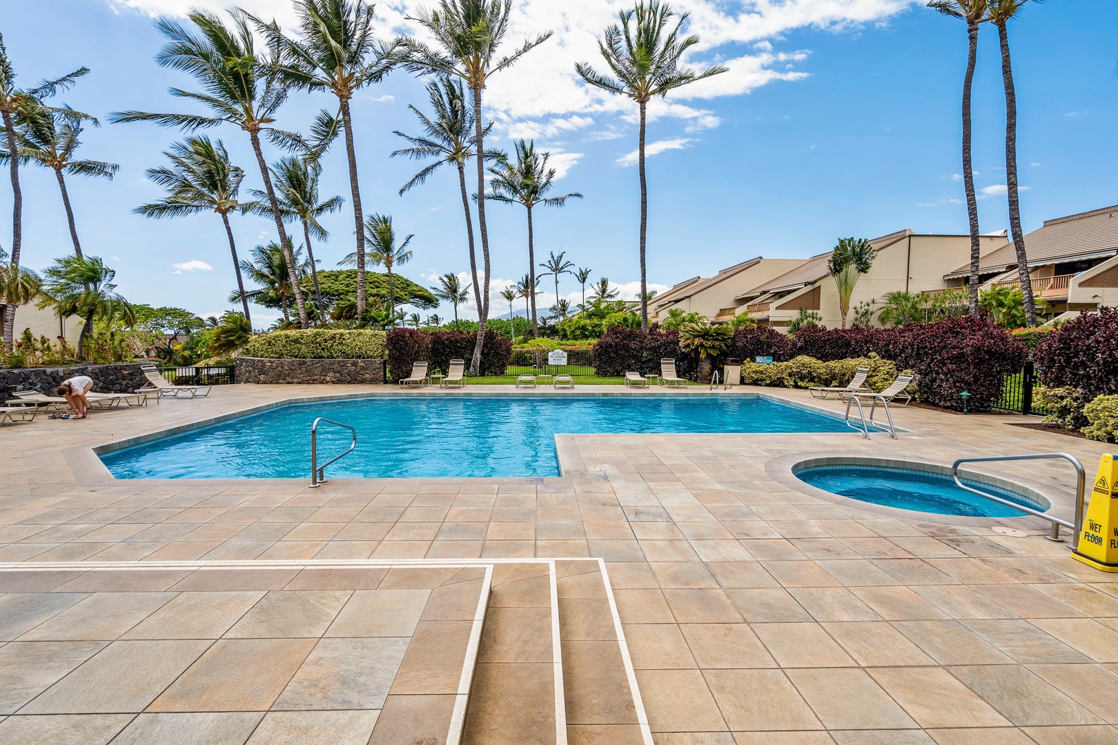 Kihei Vacation Rentals, Maui Kamaole E103 - Palm trees ring the main pool, with a small jacuzzi tucked at the far end for later.