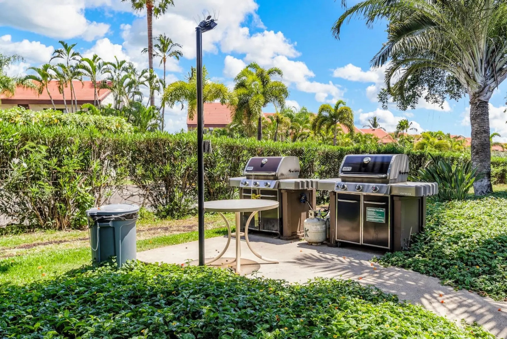 Kihei Vacation Rentals, Maui Kamaole E103 - Fire up one of the two community grills for a dinner the group cooks together.