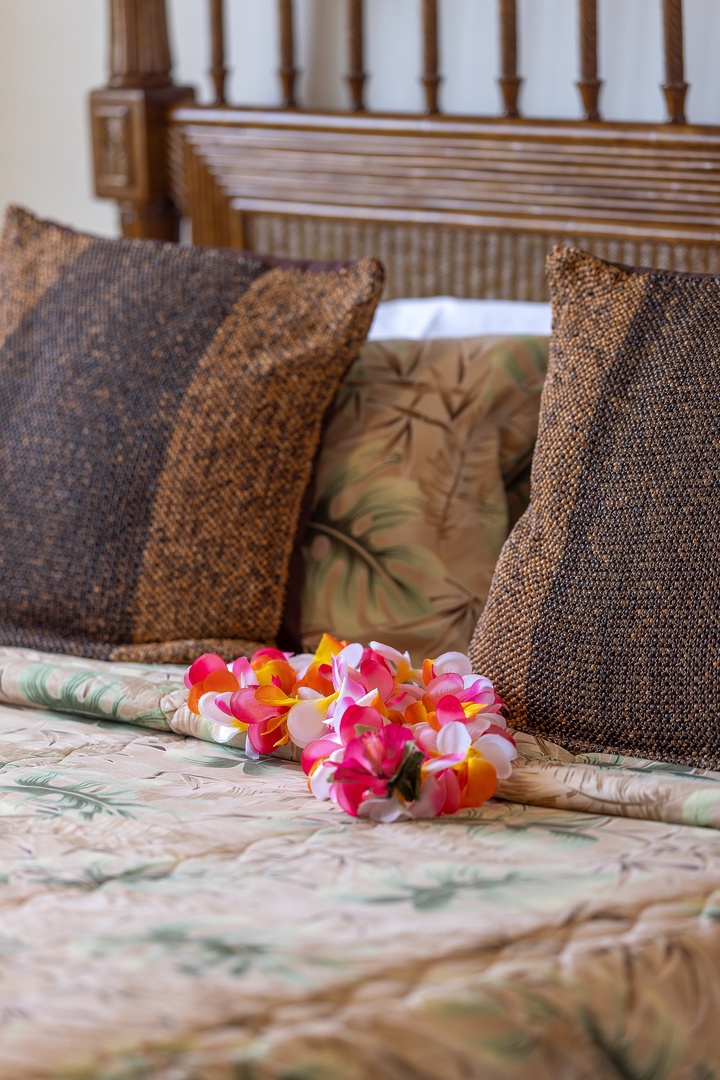 Kapolei Vacation Rentals, Ko Olina Kai 1105E - Slip into your cozy island retreat, where tropical charm meets comfort. Plush pillows and a welcoming lei promise restful, rejuvenating nights in paradise.