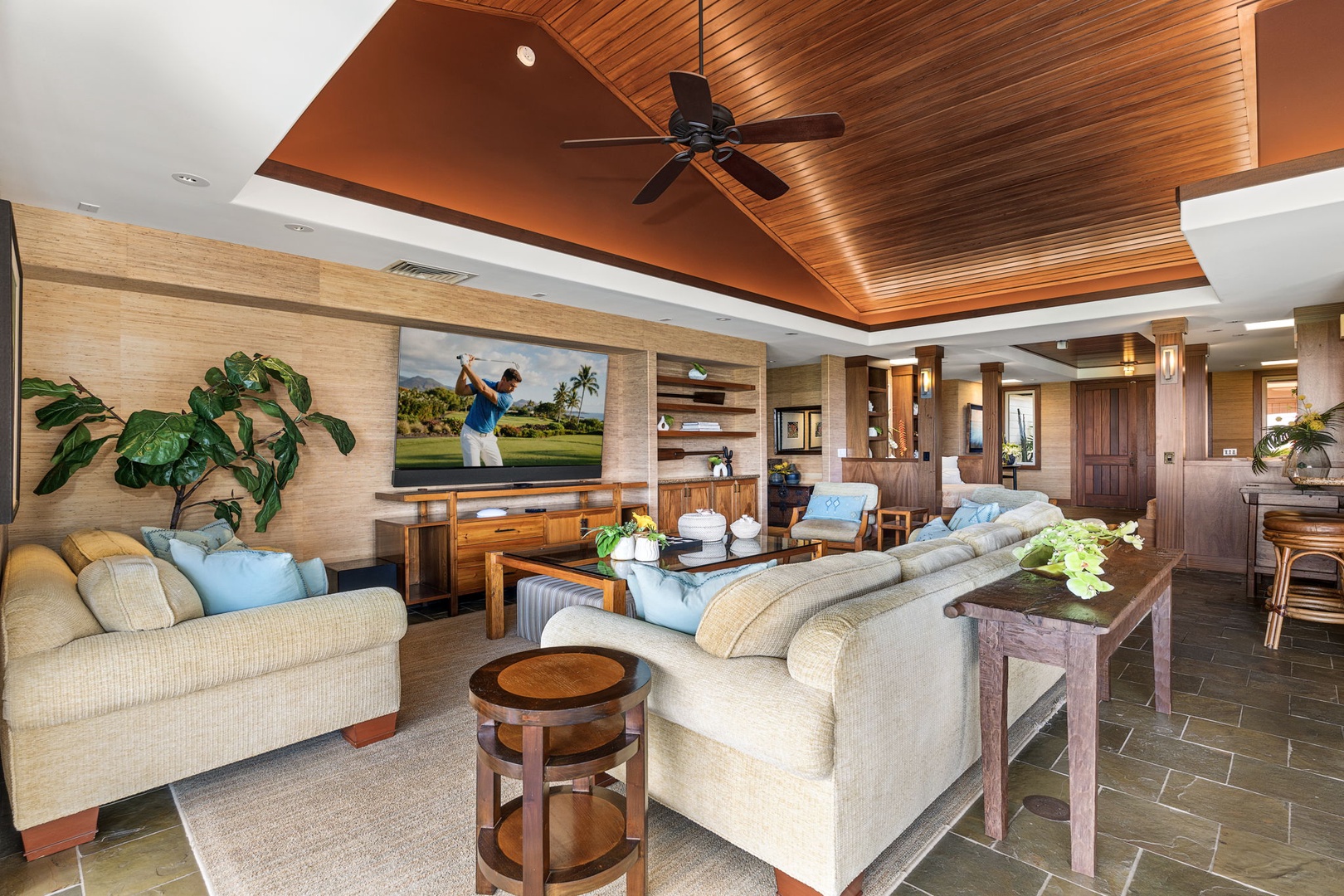 Kailua Kona Vacation Rentals, 3BD Pakui Street Estate (149) at Hualalai Resort - Sofas gathered around the screen, the room open behind them.