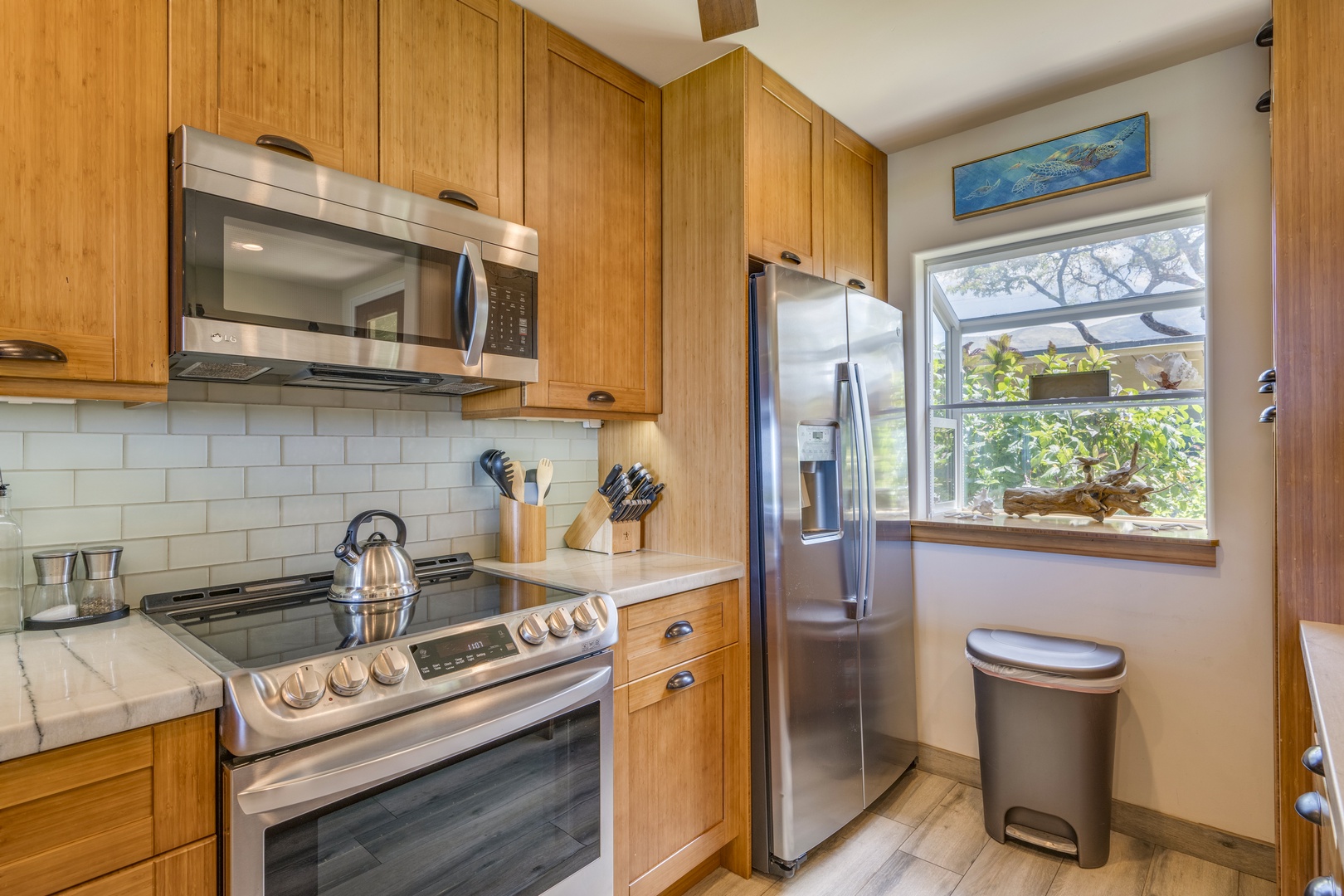 Lahaina Vacation Rentals, Puamana 240-3 - The kitchen is fully equipped with modern appliances and everything you need to prepare island-inspired meals at home.